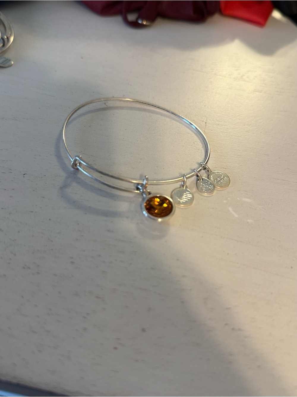 Alex and Ani Silver Bangle Bracelet with Amber-Colored Charm